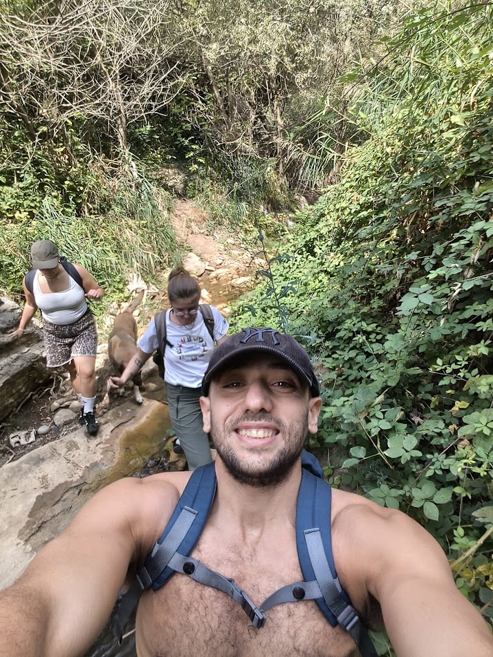 Usuf hiking with fellow travelers in nature